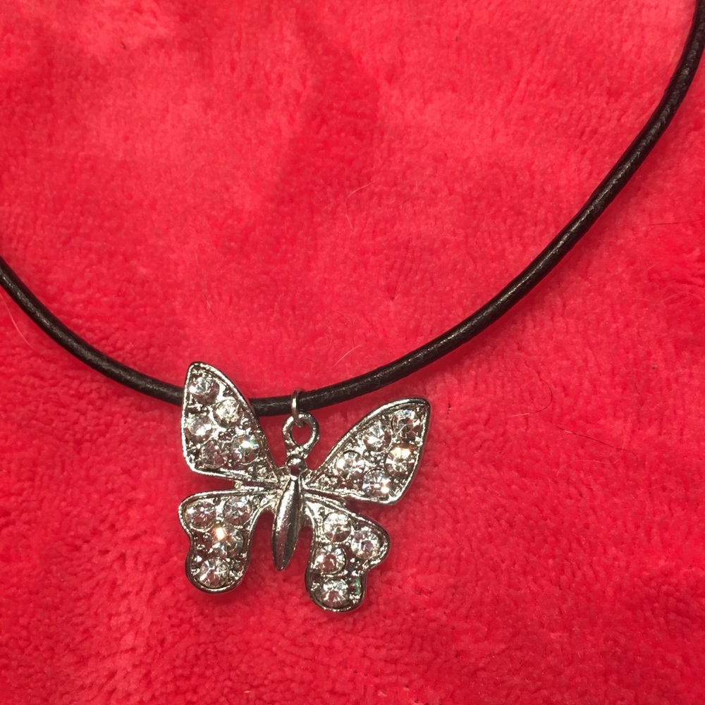 Bling butterfly pendant on black leather cord